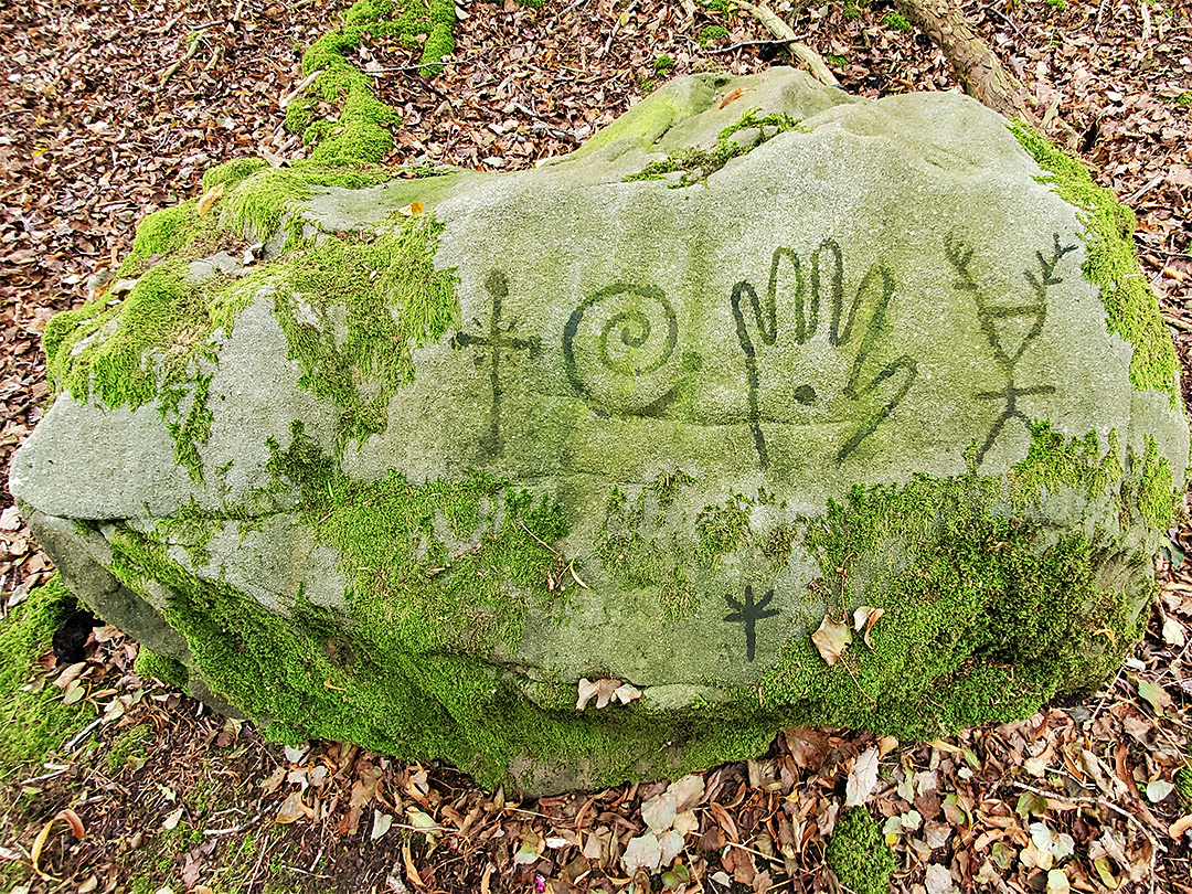 Effigies on a boulder